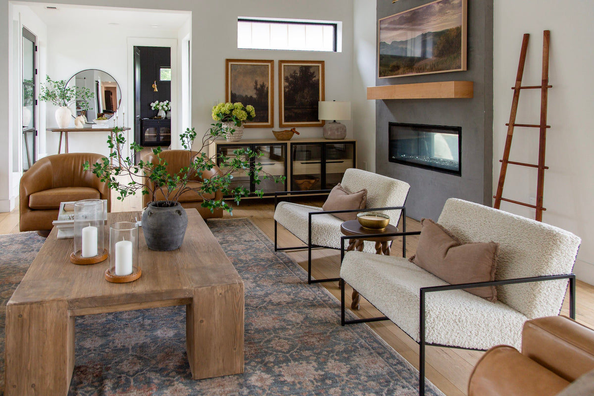 Wide living room with leather chair, wood coffee table and console